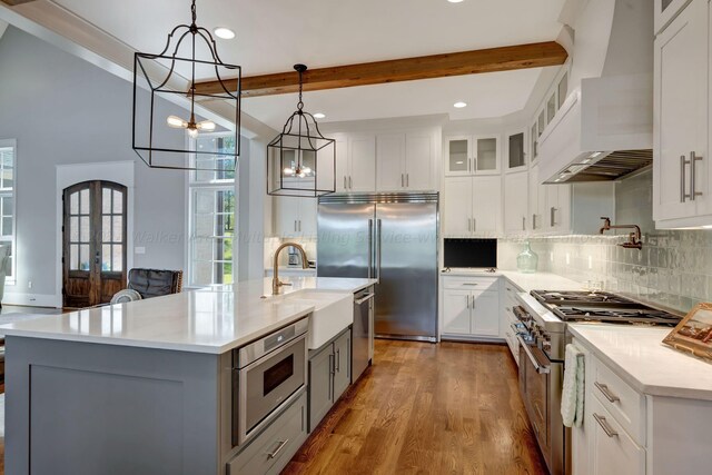 397 Blue Water Pointe Dr, Jasper, AL 35504 - kitchen featuring beamed ceiling, premium range hood, a sink, premium appliances, and a notable chandelier