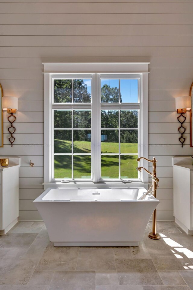 397 Blue Water Pointe Dr, Jasper, AL 35504 - full bath featuring wood walls, a soaking tub, and plenty of natural light