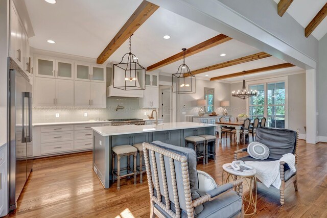 397 Blue Water Pointe Dr, Jasper, AL 35504 - kitchen featuring light countertops, appliances with stainless steel finishes, white cabinetry, an inviting chandelier, and backsplash