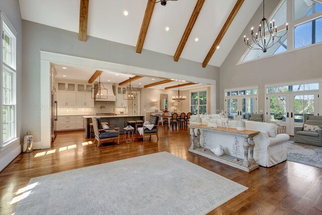 397 Blue Water Pointe Dr, Jasper, AL 35504 - living area featuring an inviting chandelier, high vaulted ceiling, beam ceiling, and wood finished floors