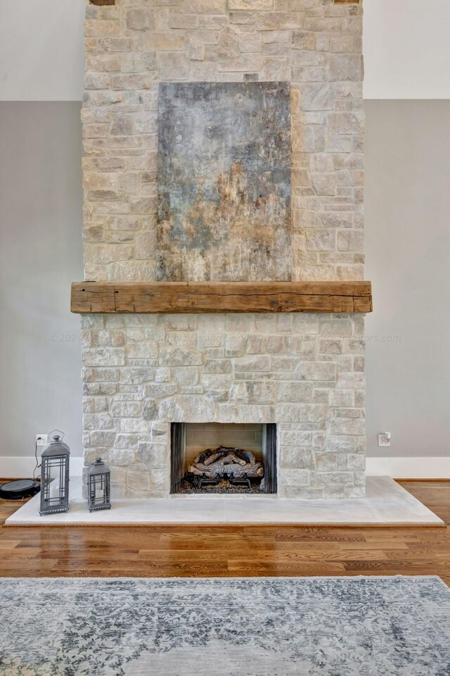 397 Blue Water Pointe Dr, Jasper, AL 35504 - room details featuring baseboards, wood finished floors, and a stone fireplace