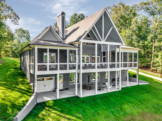397 Blue Water Pointe Dr, Jasper, AL 35504 - rear view of property featuring a sunroom, a patio, a chimney, roof with shingles, and a lawn