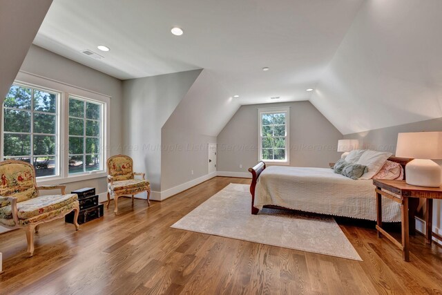 397 Blue Water Pointe Dr, Jasper, AL 35504 - bedroom featuring recessed lighting, baseboards, vaulted ceiling, and wood finished floors
