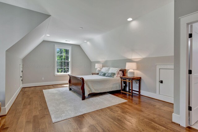 397 Blue Water Pointe Dr, Jasper, AL 35504 - bedroom with baseboards, wood finished floors, and vaulted ceiling