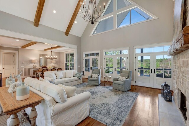 397 Blue Water Pointe Dr, Jasper, AL 35504 - living room featuring french doors, high vaulted ceiling, a chandelier, beamed ceiling, and wood finished floors