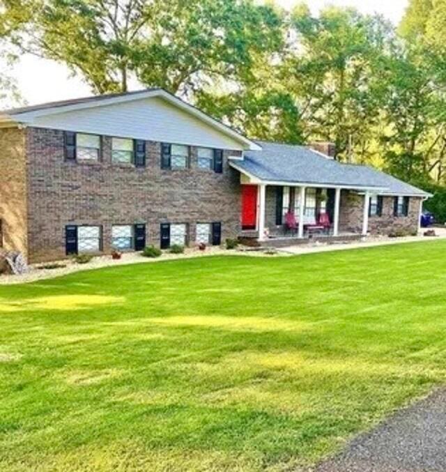 split level home with a front yard