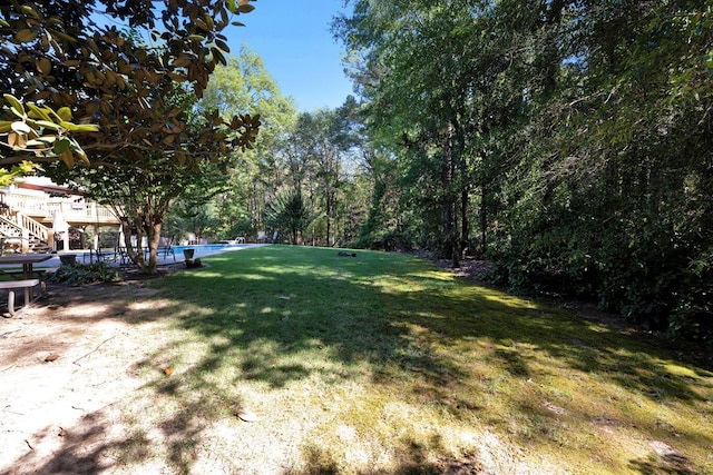 view of yard featuring an outdoor pool