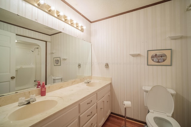 bathroom with wallpapered walls and toilet