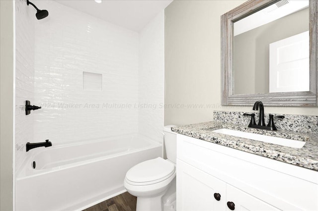 3195 County Road 51, Bremen, AL 35033 - bathroom featuring toilet, vanity,  shower combination, wood finished floors, and visible vents