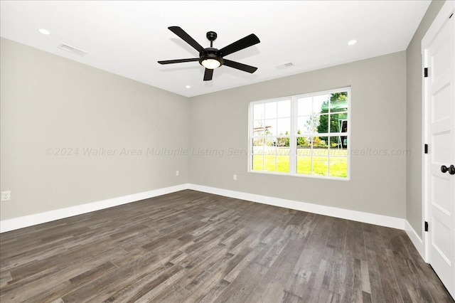 3195 County Road 51, Bremen, AL 35033 - unfurnished room featuring dark wood-type flooring, baseboards, ceiling fan, and visible vents
