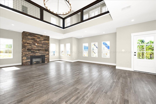 3195 County Road 51, Bremen, AL 35033 - unfurnished living room featuring a high ceiling, visible vents, baseboards, and wood finished floors