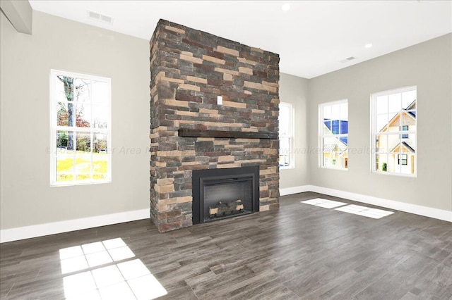 3195 County Road 51, Bremen, AL 35033 - unfurnished living room with wood finished floors, baseboards, a fireplace, and visible vents