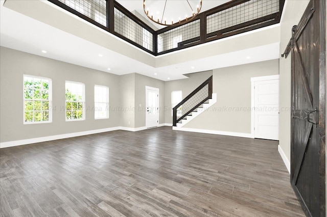 3195 County Road 51, Bremen, AL 35033 - entryway featuring baseboards, a barn door, stairway, and wood finished floors