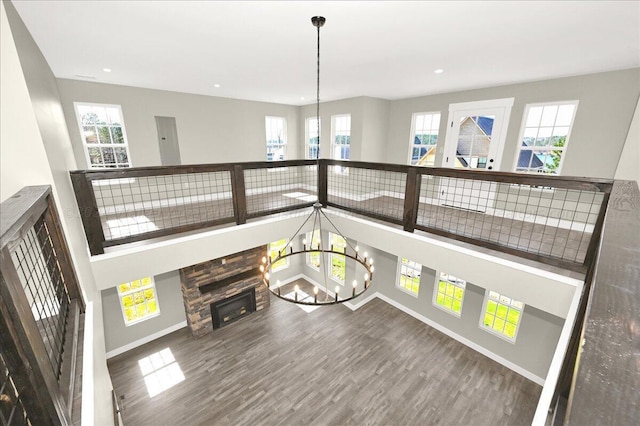 3195 County Road 51, Bremen, AL 35033 - interior space featuring baseboards, a healthy amount of sunlight, wood finished floors, and an inviting chandelier