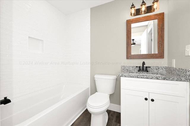 3195 County Road 51, Bremen, AL 35033 - bathroom with baseboards, ceiling fan, wood finished floors, toilet, and vanity