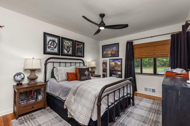 400 N Crest Cir, Jasper, AL 35501 - bedroom with baseboards, wood finished floors, and a ceiling fan