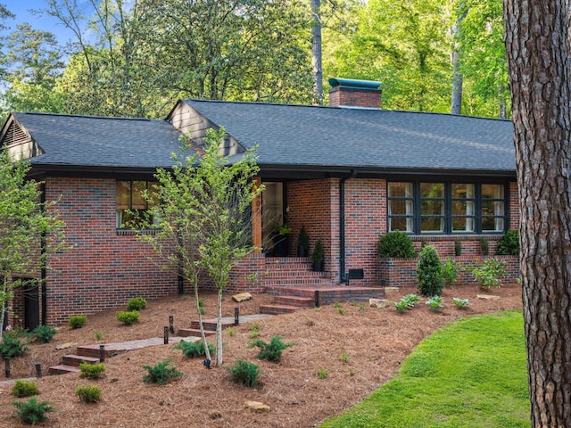400 N Crest Cir, Jasper, AL 35501 - view of front of property with roof with shingles, brick siding, and a chimney