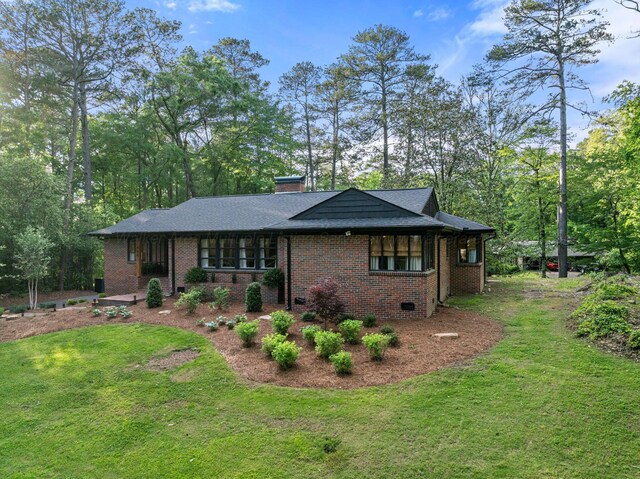 400 N Crest Cir, Jasper, AL 35501 - view of front facade with a front yard, brick siding, and a chimney