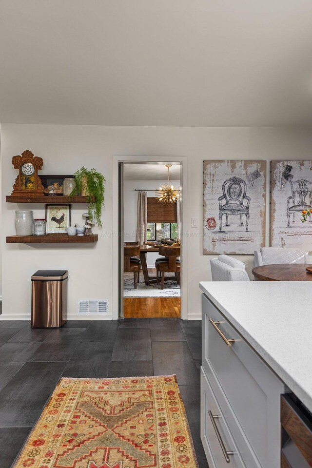 400 N Crest Cir, Jasper, AL 35501 - dining area featuring a chandelier and baseboards