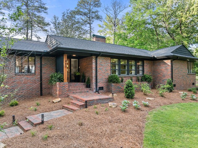400 N Crest Cir, Jasper, AL 35501 - view of front of house with brick siding, a chimney, and roof with shingles
