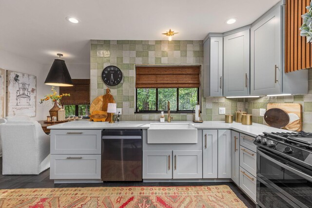 400 N Crest Cir, Jasper, AL 35501 - kitchen featuring dishwasher, a sink, double oven range, light countertops, and decorative backsplash
