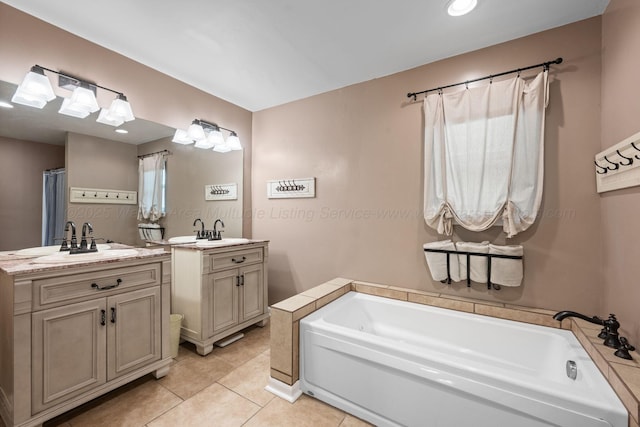 58 Lake Ln, Jasper, AL 35504 - bathroom with tile patterned floors, two vanities, a sink, and a garden tub