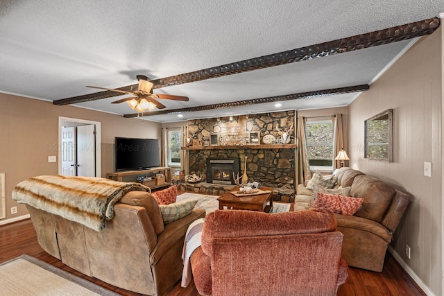 58 Lake Ln, Jasper, AL 35504 - living room featuring baseboards, a fireplace, a textured ceiling, a ceiling fan, and wood finished floors