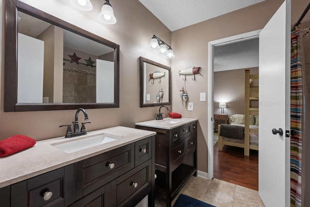 58 Lake Ln, Jasper, AL 35504 - full bath featuring two vanities, a sink, tile patterned flooring, and ensuite bath
