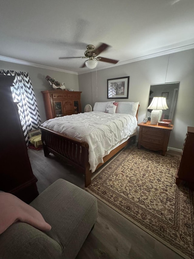 1107 Forest Rd, Jasper, AL 35504 - bedroom featuring ornamental molding, a ceiling fan, and wood finished floors