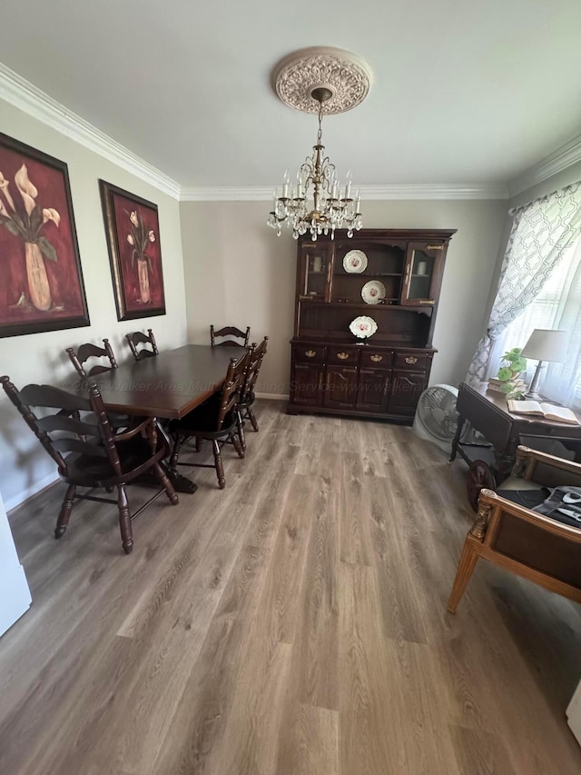 1107 Forest Rd, Jasper, AL 35504 - dining room featuring crown molding, a chandelier, and light wood-style flooring