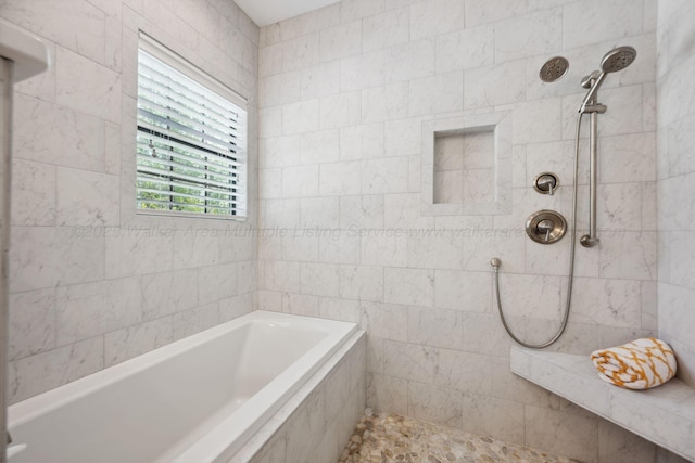 full bath featuring tiled shower and a garden tub