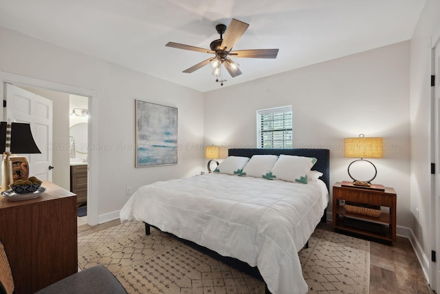 bedroom featuring ceiling fan, light wood-style floors, connected bathroom, and baseboards