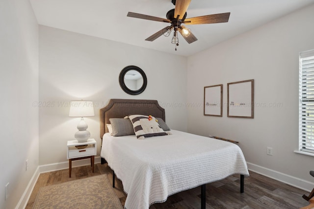 bedroom with baseboards, wood finished floors, and ceiling fan