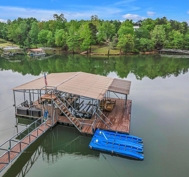 dock area featuring a water view and a view of trees