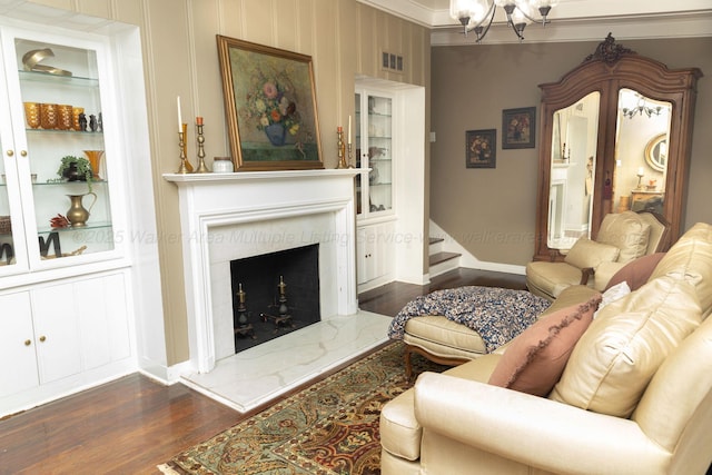 605 W 6th St, Jasper, AL 35501 - living area featuring a fireplace, dark wood-style floors, a chandelier, stairway, and built in features