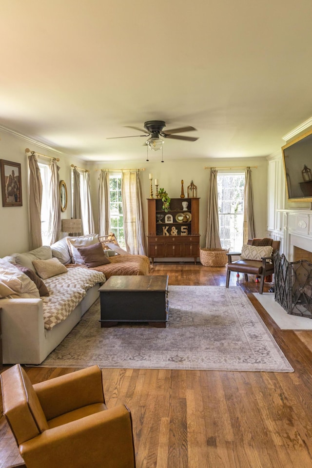 605 W 6th St, Jasper, AL 35501 - living area featuring healthy amount of natural light, ceiling fan, wood finished floors, and crown molding