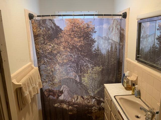 bathroom with vanity and walk in shower