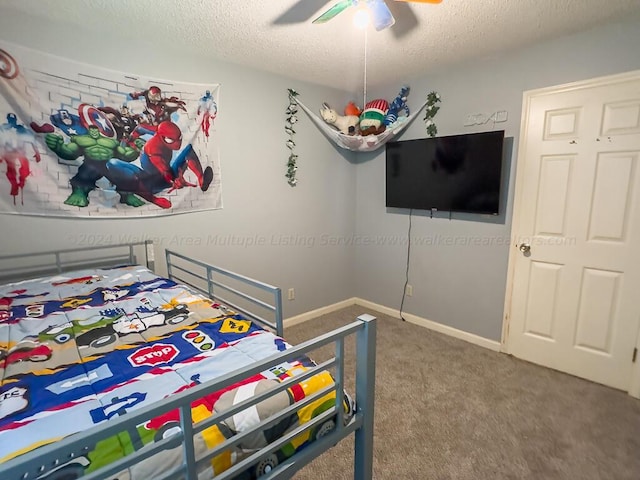 501 Duskin Rd, Jasper, AL 35504 - carpeted bedroom with baseboards, a ceiling fan, and a textured ceiling