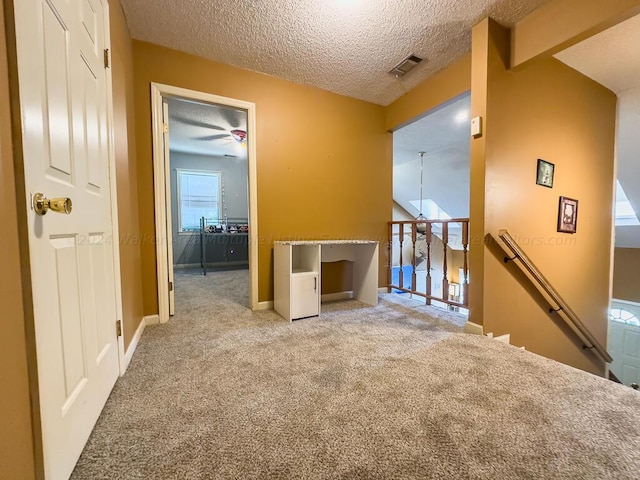 501 Duskin Rd, Jasper, AL 35504 - interior space featuring an upstairs landing, carpet, baseboards, a textured ceiling, and visible vents