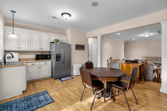 1528 Sipsey Rd, Double Springs, AL 35553 - dining space featuring light wood-type flooring, decorative columns, and recessed lighting