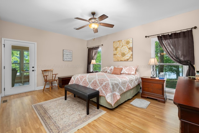 1528 Sipsey Rd, Double Springs, AL 35553 - bedroom featuring multiple windows, light wood finished floors, and access to outside