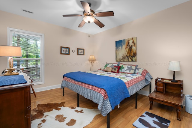 1528 Sipsey Rd, Double Springs, AL 35553 - bedroom with light wood-type flooring and ceiling fan