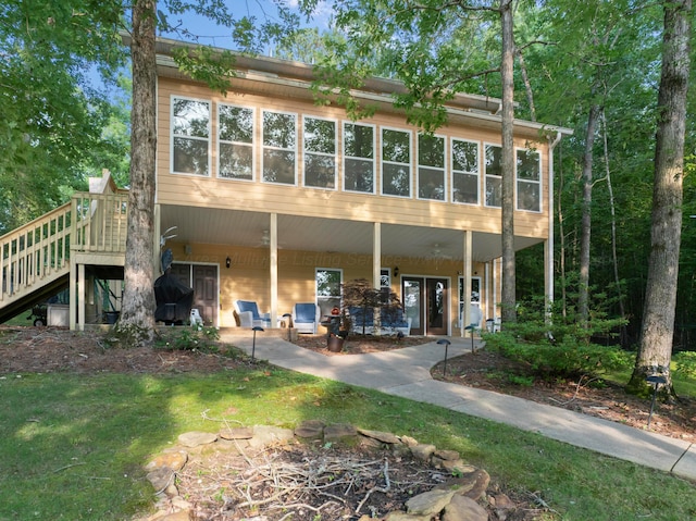 1528 Sipsey Rd, Double Springs, AL 35553 - rear view of house with stairway and a sunroom
