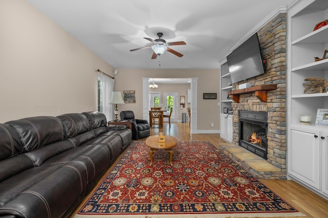 1528 Sipsey Rd, Double Springs, AL 35553 - living area with ceiling fan, light wood finished floors, a fireplace, and a chandelier