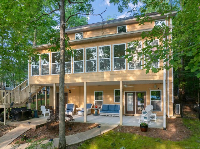1528 Sipsey Rd, Double Springs, AL 35553 - back of property featuring ceiling fan, a patio area, an outdoor living space, and a sunroom