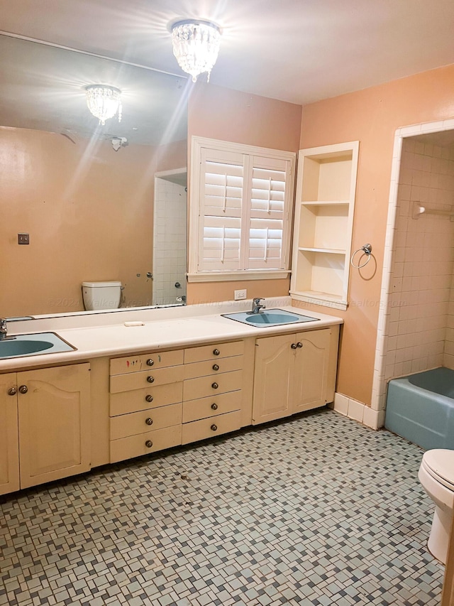 307 Amory Ave, Cordova, AL 35550 - full bathroom with double vanity, a bath, toilet, and a sink