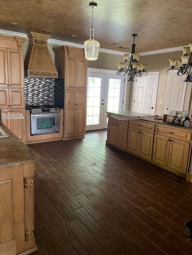130 Quail Run Dr, Winfield, AL 35594 - kitchen featuring oven, a chandelier, custom range hood, crown molding, and dark wood-style floors