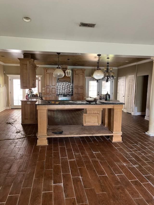 130 Quail Run Dr, Winfield, AL 35594 - kitchen featuring baseboards, dark countertops, ornamental molding, recessed lighting, and healthy amount of natural light