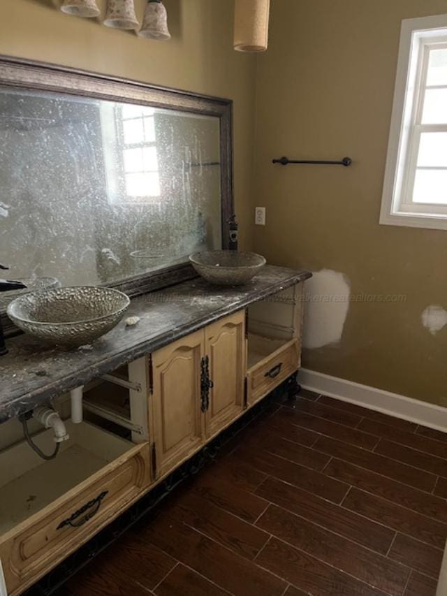 130 Quail Run Dr, Winfield, AL 35594 - bathroom with baseboards, wood finished floors, and double vanity