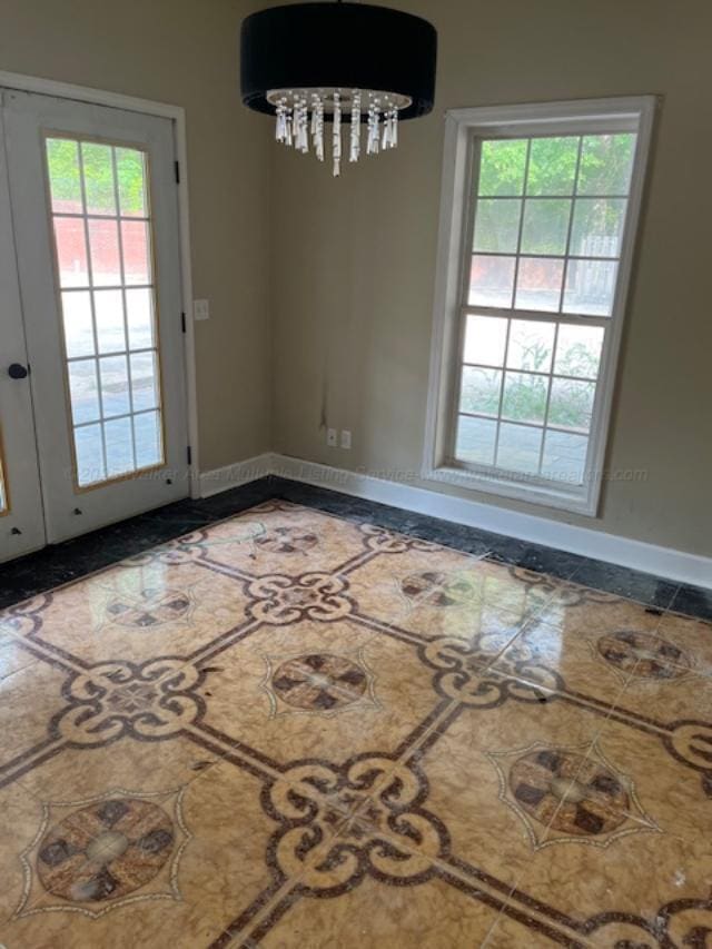 130 Quail Run Dr, Winfield, AL 35594 - unfurnished dining area with baseboards and inlaid floor details